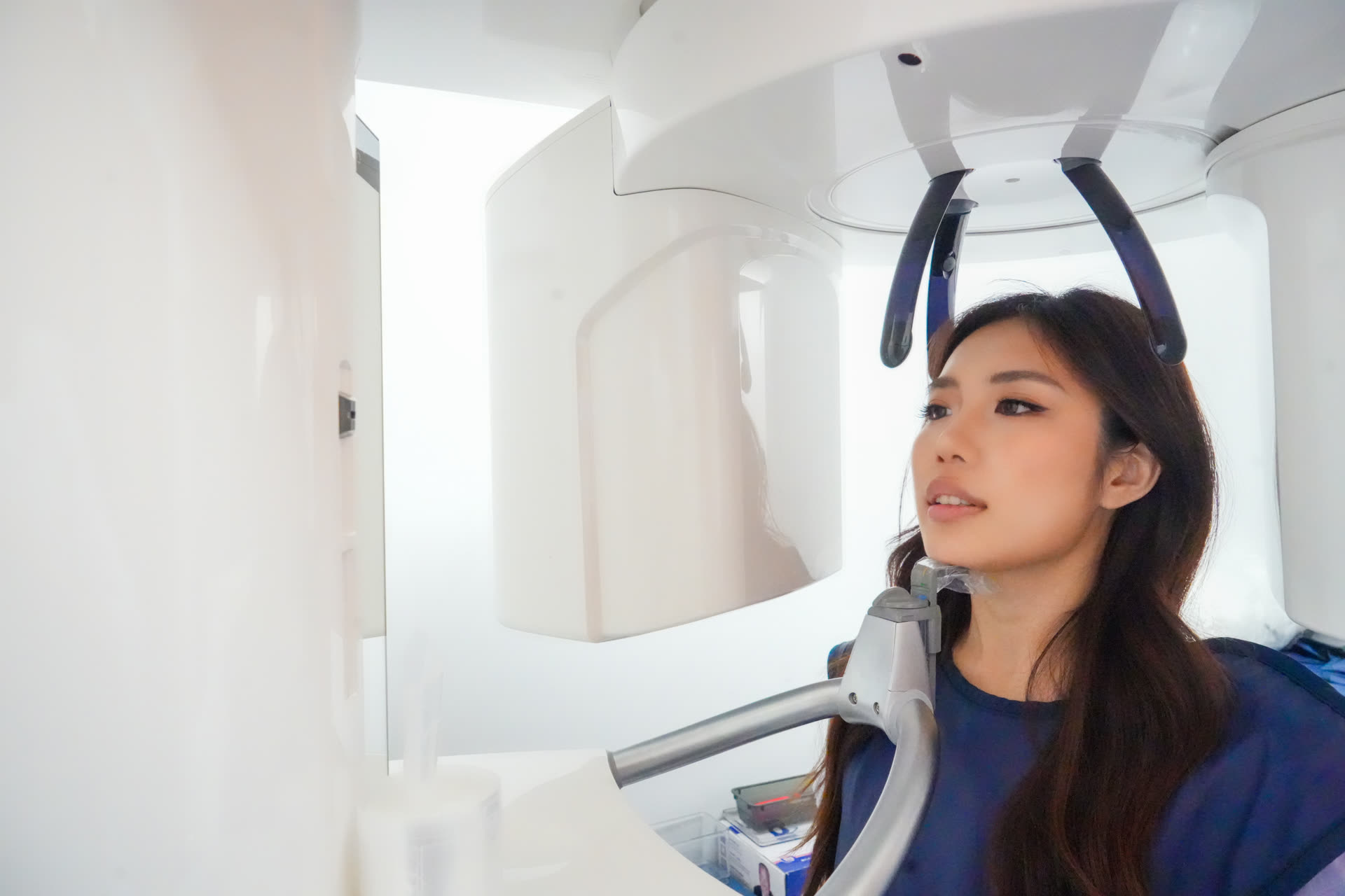 A patient consultation using 3D CBCT imaging at Centre Dental in New York